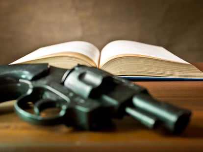 open book with handgun