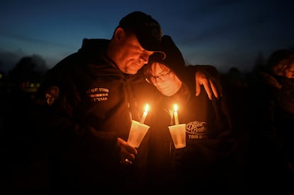 People attend a vigil after a shooting at Perry High School, in Perry, Iowa, on January 4, 2024.
