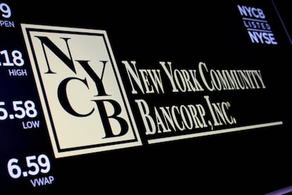 A screen displays the trading information for New York Community Bancorp on the floor at the New York Stock Exchange (NYSE) in New York City, U.S.