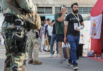 Survivors of the Ionian Sea shipwreck prepare to board a bus at the port of Kalamata, bound for Athens, June 16, 2023.