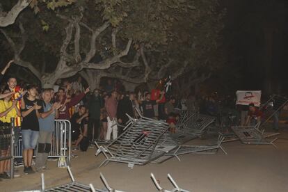 Protesters took down the security fence surrounding the regional parliament in Barcelona.