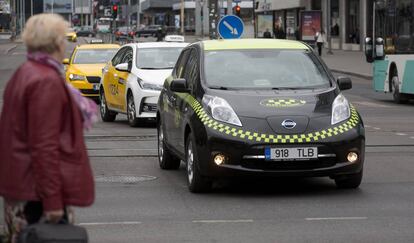 An electric taxi driving through the center of Tallin, Estonia.