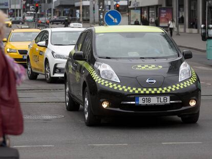 An electric taxi driving through the center of Tallin, Estonia.