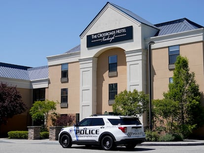 A Town of Newburgh police vehicle sits parked outside The Crossroads Hotel, where two busloads of migrants arrived hours earlier, on May 11, 2023, in Newburgh, N.Y.