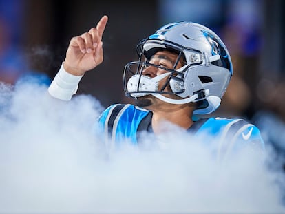 Carolina Panthers quarterback Bryce Young points to the sky as he takes the field prior to an NFL preseason football game against the Detroit Lions, Friday, Aug. 25, 2023, in Charlotte, N.C.