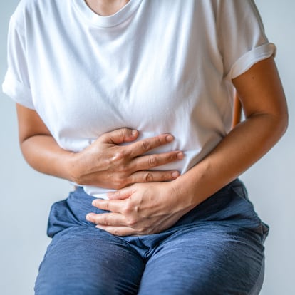 woman with stomach ache, menstrual period cramp, abdominal pain, food poisoning