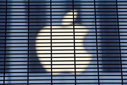 FILE PHOTO: The Apple logo is seen through a security fence erected around the Apple Fifth Avenue store