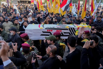 Members of an Iraqi Shiite militant group carry the coffin during the funeral of a fighter with the Kataib Hezbollah, who was killed in a U.S. airstrike, in Baghdad, Iraq, Jan. 25, 2024.