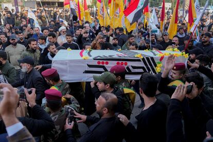 Members of an Iraqi Shiite militant group carry the coffin during the funeral of a fighter with the Kataib Hezbollah, who was killed in a U.S. airstrike, in Baghdad, Iraq, Jan. 25, 2024.