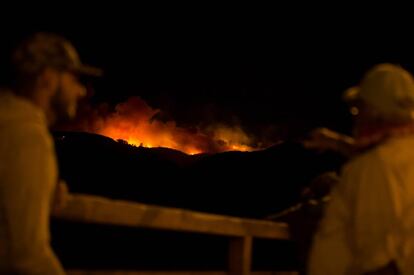 Flames and smoke from a forest fire are seen in the village of Ingenio, in Gran Canaria, Canary Islands.