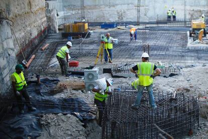 Workers on a construction site in Seville.