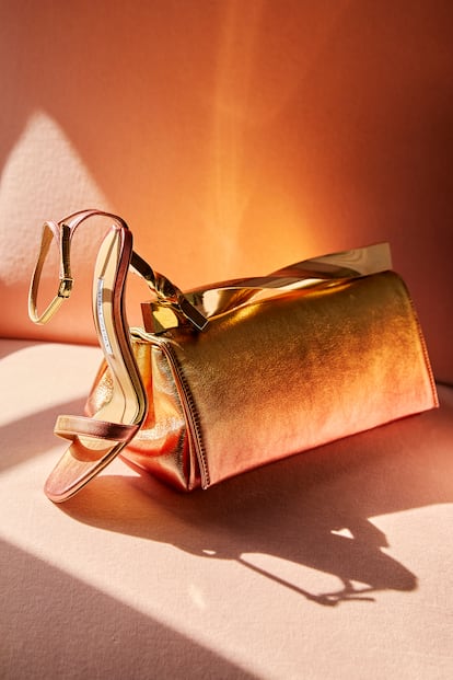 Leather sandals with matching bag from Edgardo Osoria’s latest collection.