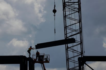 Workers building an electric car battery plant near DeSoto, Kansas.