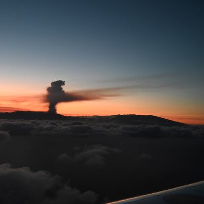In this photo provided by the Spanish government and taken from a plane carrying Spain's Prime Minister Pedro Sanchez, a volcano erupts on the island of La Palma in the Canaries, Spain, Sunday Sept. 19, 2021. Lava continues to flow slowly from a volcano that erupted in Spain’s Canary Islands off northwest Africa. The head of the islands' regional government said Monday he expects no injuries to people in the area after some 5,000 were evacuated.(Borja Puig de la Bellacasa/Spanish Government via AP)