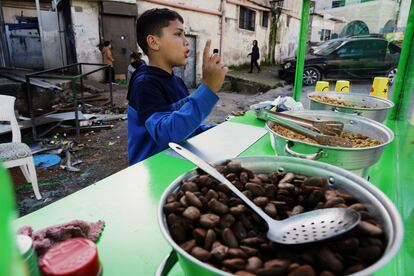 Brahim Kakur, 11, at a food stall after attending school in the Aida refugee camp. 