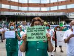 Health workers of the Hospital 12 de Octubre demonstrate in support of public health, in Madrid on Monday, May 25, 2020.
en la foto : pancarta " quien cuida de quien te cuida? sanidad 100 % publica "