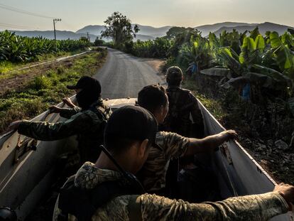 Members of the civil defense groups in Coahuayana, a municipality in the western Mexican state of Michoacán, carry out a shift change, on May 24, 2024.