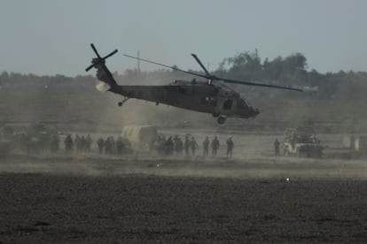 Israeli military helicopter lands near the Gaza Strip border on Saturday, Dec. 9, 2023