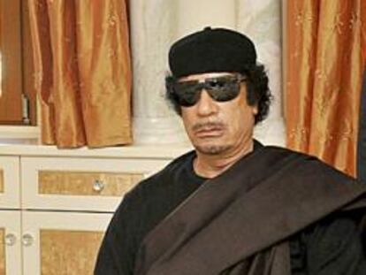 Muammar Gaddafi.