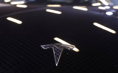 The logo of Tesla carmaker is seen on a car at the Top Marques fair in Monaco