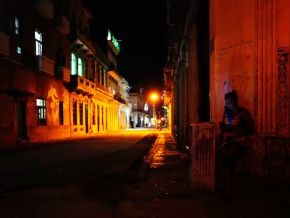 A woman on her cell phone in downtown Havana, Cuba, on March 17, 2024.