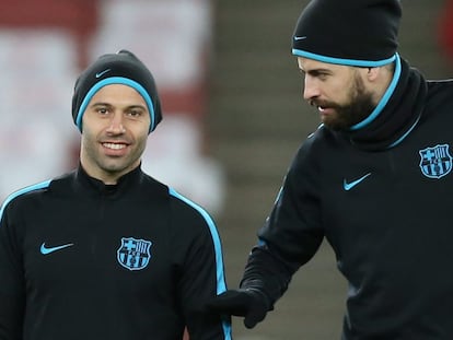 Javier Mascherano y Gerard Piqué.