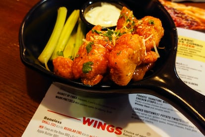 An order of "boneless chicken wings" is shown at a restaurant in Willow Grove, Pa., Wednesday, Feb. 8, 2023. With the Super Bowl at hand, behold the cheerful untruth that has been perpetrated upon (and generally with the blessing of) the chicken-consuming citizens of the United States on menus across the land: a “boneless wing” that isn’t a wing at all. (AP Photo/Matt Rourke)