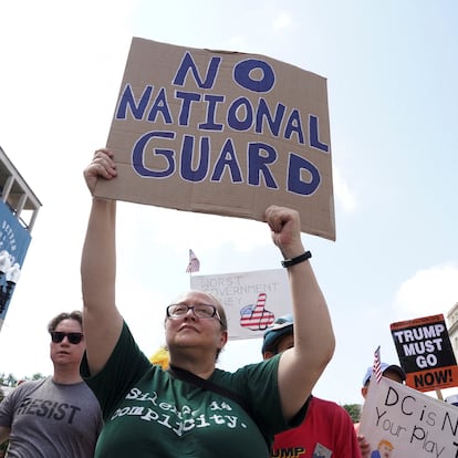 Protesters gather near the White House, as U.S. President Donald Trump announced he is placing the D.C. Metropolitan Police Department under direct federal control and deploying National Guard troops to Washington, D.C, in Washington D.C., U.S., August 11, 2025. REUTERS/Ken Cedeno