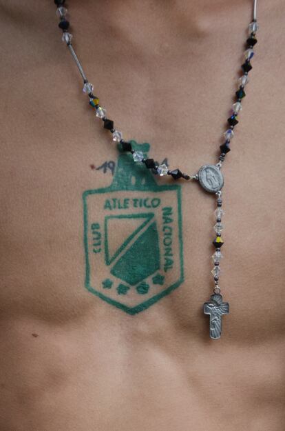 The crest of Atlético Nacional tattooed on the chest of a fan.