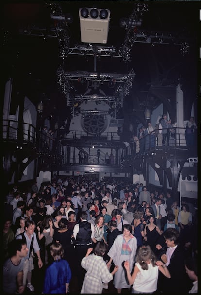 Dancers party to electronic music at the Limelight Club in New York, located in what was once a church.