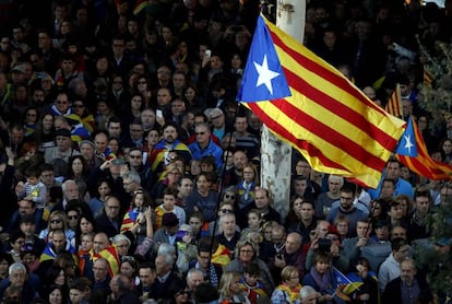 Supporters of independence waving an 'estelada,' the unofficial flag of Catalan separatists.