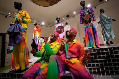 From left, designers Glen and Bruce Proctor laugh as they pose for portraits in front of their creations at the fashion hub, during the women's Spring Summer 2024 fashion week, in Milan, Italy, Thursday, Sept. 21, 2023.