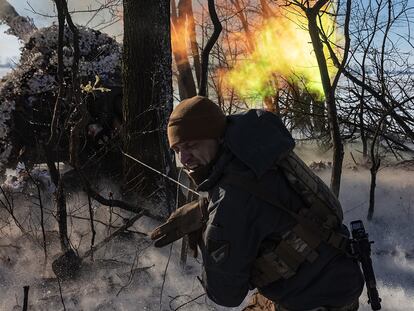 POKROVSK, UKRAINE - FEBRUARY 17: A man walks his bike past the scene of a Russian missile strike on an administrative building in the suburbs of Pokrovsk, Ukraine on 17 February 2025. (Photo by