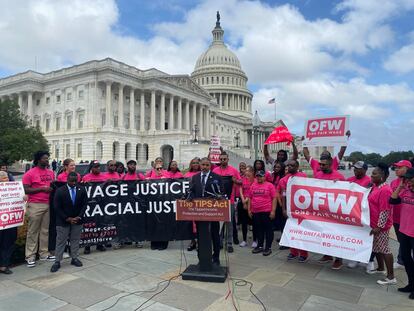 Democratic Representative for Nevada, Steven Horsford, with members of the organization One Fair Wage, in front of the Capitol in Washington.