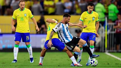 Lionel Messi of Argentina and André of Brazil