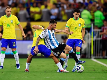 Lionel Messi of Argentina and André of Brazil