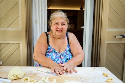 Nunzia Castro makes orecchiette in front of her house in Bari