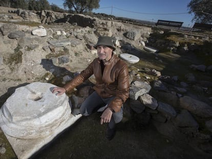 Archeologist Juan Manuel Rojas, with one of the tombstones at the Guarrazar basilica.