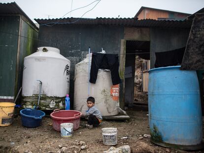 A child plays outside his home in the Nadine Heredia area in San Juan de Miraflores; Lima, Peru.