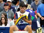 Carlos Alcaraz, of Spain, sits during a break in his match against Peter Gojowczyk, of Germany, during the fourth round of the U.S. Open tennis championships, Sunday, Sept. 5, 2021, in New York. (AP Photo/Frank Franklin II)