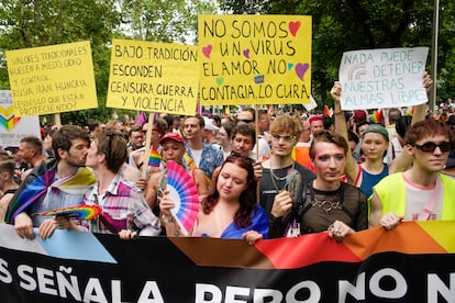 Manifestantes con pancartas durante la marcha del Orgullo en Madrid, este sábado. 