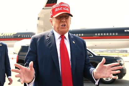 Former president Donald Trump speaks to reporters after arriving at Hartsfield-Jackson Atlanta International Airport, in Atlanta, Georgia, on April 10, 2024, before attending a political fundraiser.