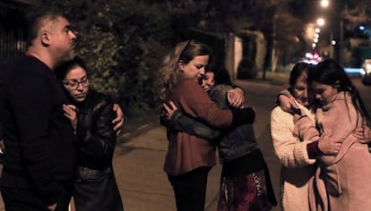 A group of Chileans waits in the street after the quake.