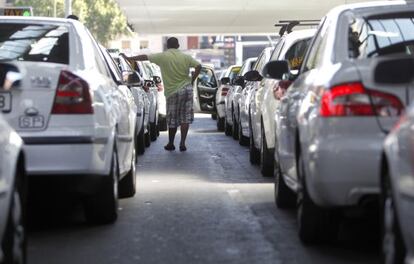 A taxi driver waits for a fare at Madrid&#039;s Atocha railway station. 