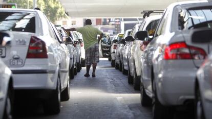 A taxi driver waits for a fare at Madrid's Atocha railway station.