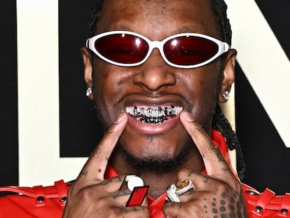 Stylist and influencer Bloody Osiris, seen wearing his grill, attends a runway show during Paris Fashion Week, on January 20.