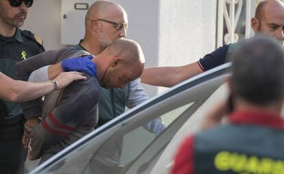 Thomas Handrick being led out of his home in Adeje, Tenerife.