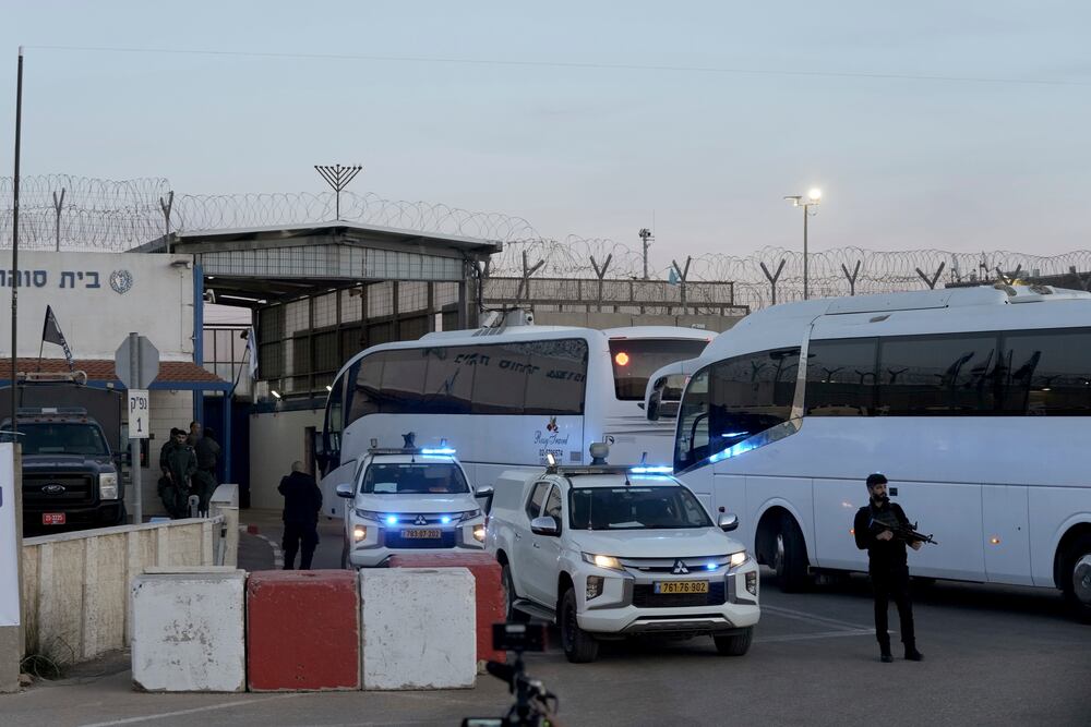 Israeli buses enter the Ofer military prison near Jerusalem on Sunday, Jan. 19, 2025. (AP Photo/Mahmoud Illean)