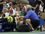 NEW YORK, NEW YORK - SEPTEMBER 07: Carlos Alcaraz of Spain talks with a trainer during his Men�s Singles quarterfinals match against Felix Auger-Aliassime of Canada during on Day Nine of the 2021 US Open at the USTA Billie Jean King National Tennis Center on September 07, 2021 in the Flushing neighborhood of the Queens borough of New York City.   Sarah Stier/Getty Images/AFP
== FOR NEWSPAPERS, INTERNET, TELCOS & TELEVISION USE ONLY ==