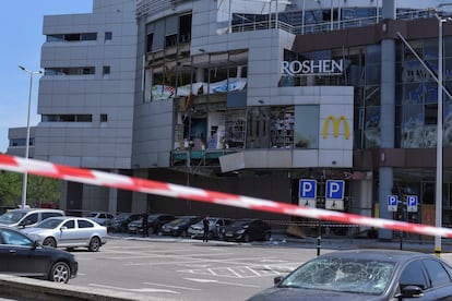 Ukrainian police are working at a shopping centre damaged by a Russian missile and drone attack on Dnipro on 3 December.